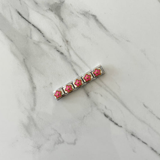 Charm florecita rosa